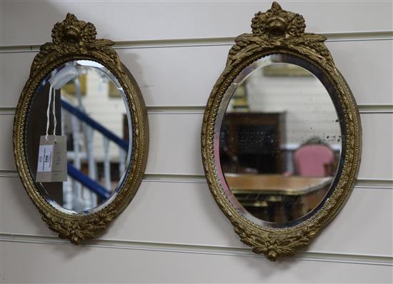 A pair of Victorian style oval gilt gesso wall mirrors H.35cm